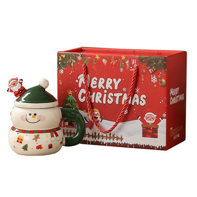 Le bonhomme de neige de Noël, une tasse de café, une tasse de ceramique, une tasse Mike, une boîte cadeau.