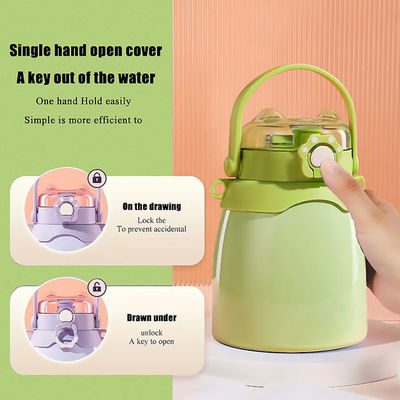 Présentation Eco-friendly imprimé sur mesure thermique double paroi isolée bouteille d'eau en acier inoxydable avec le couvercle du manche