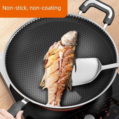 Wok en acier inoxydable à nid de miel durable pour un chauffage rapide dans une cuisine personnalisée
