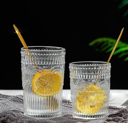 Bouteille de verre à eau de tournesol cristalline avec bordure et logo en or
